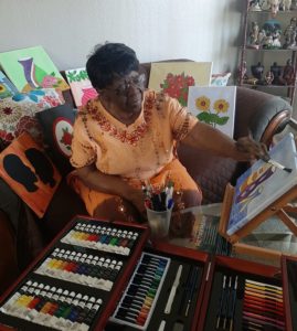 Painting at her home studio